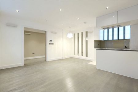 A spacious lower ground floor one bedroom apartment featuring an open plan kitchen / reception room with wood floors on the sought-after location of Montagu Square. - Photo 2