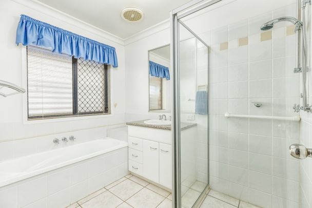 Lovely 4 Bedroom home with Side Access - Photo 1