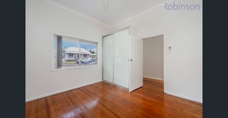 Freshly painted three bedroom home with air-conditioned living space and off street parking. - Photo 2