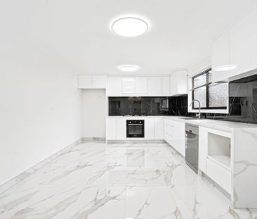 Modern Four Bedroom In a Convenient Location! - Photo 1