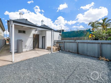 Open the Door to Coastal Charm with Modern Comfort - Photo 4