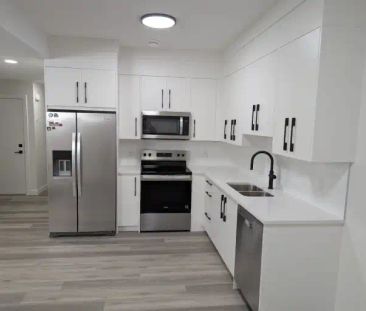 Modern One-Bedroom Basement Suite in Prestigious West Springs | Cal... - Photo 1