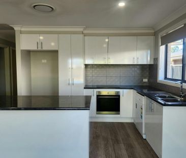 Beautiful 4-Bedroom Family Home with Outdoor Entertaining Area in a... - Photo 1