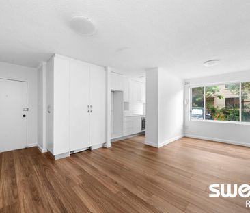 Renovated Full-Brick Unit in Prime Location - Photo 1