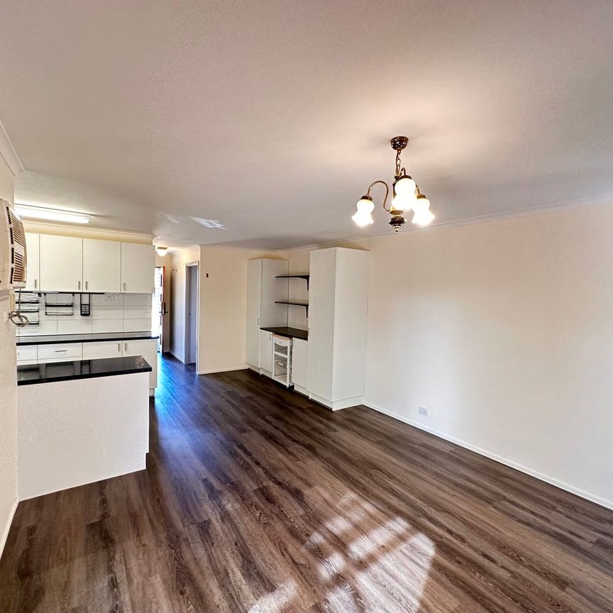 Captivating Brick Home with 3 Bedrooms and Solar Panels! - Photo 1