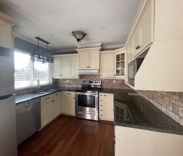 Peninsula Village Split Entry Three Bedroom Home - Photo 1