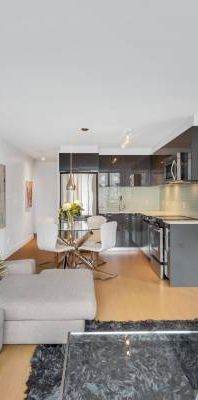 STUNNING Furn 2 bed & den condo @ ROLSTON, parking, HUGE Patio, gym - Photo 1