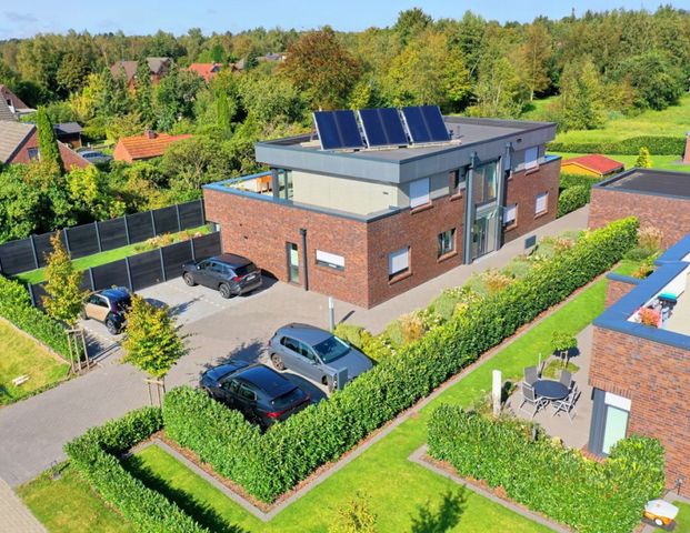 KfW 55: Exklusives Penthouse mit Einbauküche und 50 m² Dachterrasse in der Blumenstadt Wiesmoor - Foto 1