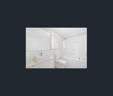 Near New Modern 4-Bedroom Family Home in Logan Reserve! - Photo 2