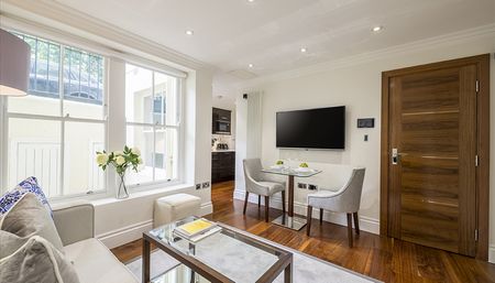 A beautifully refurbished one-bed apartment set on the lower ground floor in Bayswater, London W2 - Photo 2