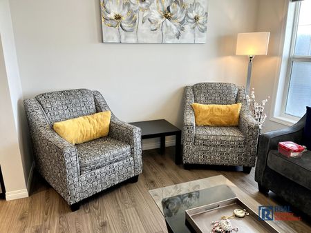 10799 Cityscape Drive NE | Townhouse | 3-bedroom, 2.5-bathroom | Double Garage - Photo 3