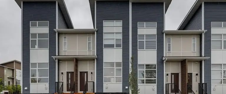 Brand New Upgraded 3 Bedroom Townhome with Double Garage Across Green Space | 124 Walden Lane Southeast, Calgary - Photo 1