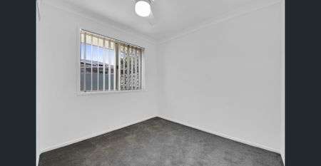 Lovely Four Bedroom Home with and a Big Backyard! - Photo 3