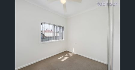 Freshly painted three bedroom home with air-conditioned living space and off street parking. - Photo 3