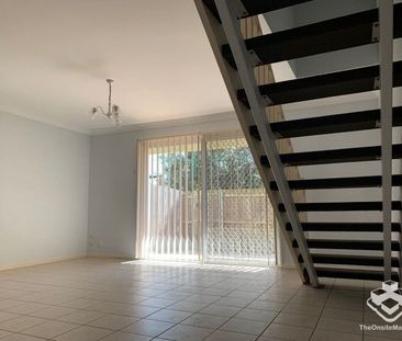 A LOVELY TOWNHOUSE IN A POPULAR BAYSIDE COMPLEX! - Photo 2