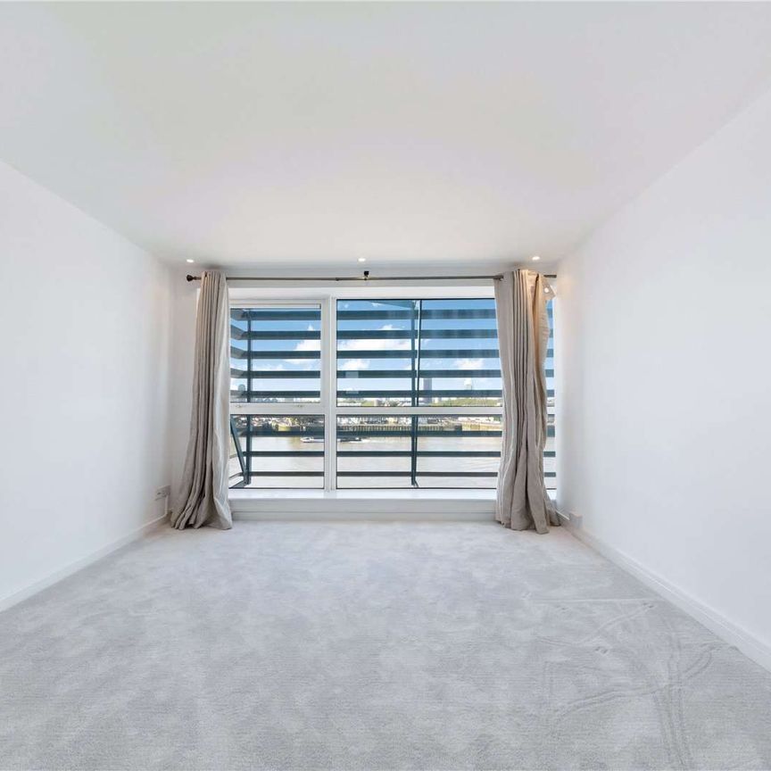 A two double bedroom duplex penthouse situated on the 6th and 7th floor of this charming gated riverside development located off Westferry Road. - Photo 1