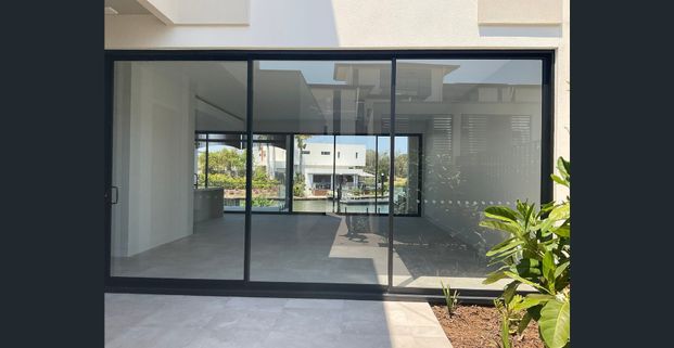 BEAUTIFUL - Brand New Villa, in Hope Island! WATERFRONT LIVING AT ITS FINEST! - Photo 1