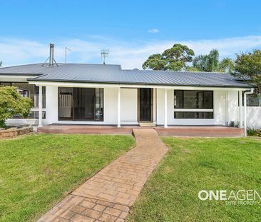 VERSATILE FAMILY LIVING: NEWLY RENOVATED FIVE-BEDROOM HOME WITH SEL... - Photo 6