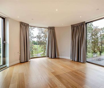 A modern third floor, two bedroom apartment with parking - Photo 2