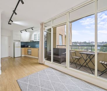 High Floor Studio Apartment with Balcony and City Views - Photo 1