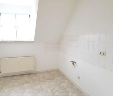 Lichtdurchflutete und großzügige 2-Zimmer-Dachgeschosswohnung im be... - Photo 1
