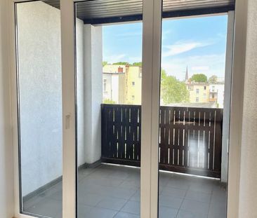 Geräumige Dachgeschosswohnung in lebendigem Innenstadtviertel - Foto 1