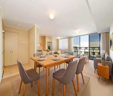 Spacious Top Floor Apartment with Sweeping Views - Photo 3