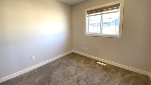 Modern 3 Storey Townhome | Double Attached Garage | Altius Tamarack - Photo 1