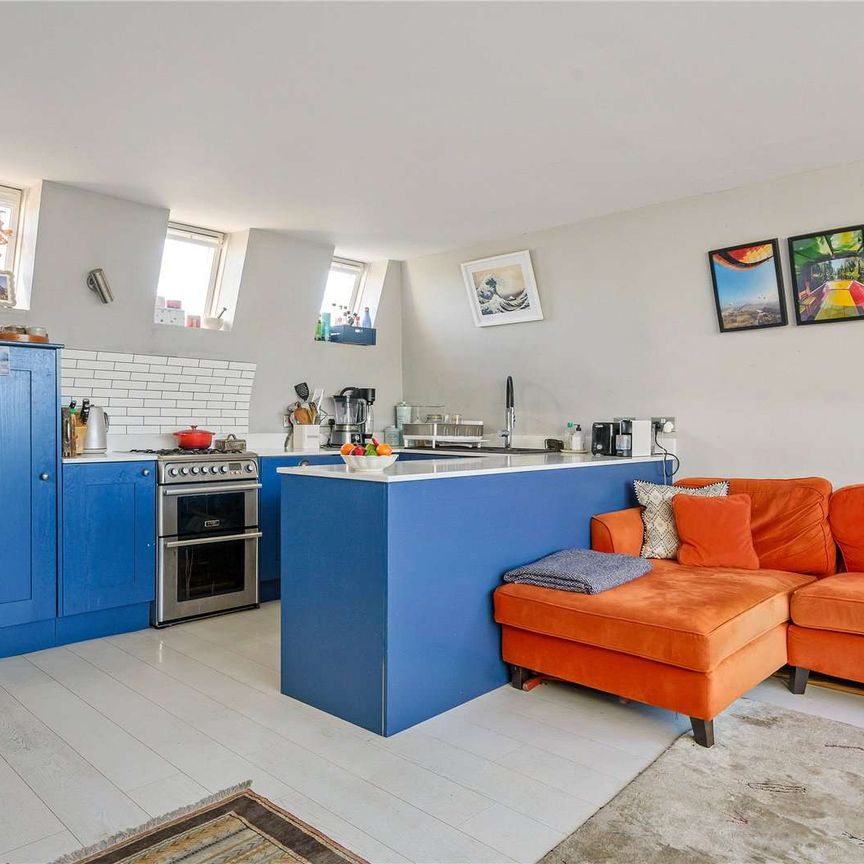 Bright split-level two bedroom home on the top floors of a period conversion - Photo 1