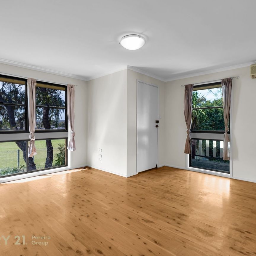 Charming Three-Bedroom Home - Photo 1