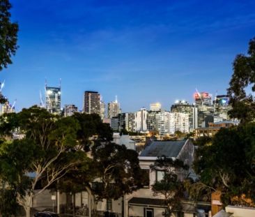 Industrial-Style Warehouse Living with Private Rooftop Terrace - Photo 2