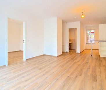 Moderne EG-Wohnung mit Terrasse, hochwertiger Ausstattung und großen Keller in zentraler Lage - Photo 3