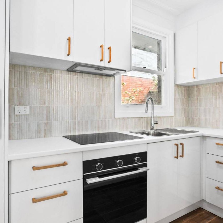 Freshly Renovated Coastal Retreat – Walk to the Beach! - Photo 1