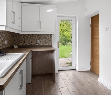 A detached three bedroom bungalow with a garage and driveway parkin... - Photo 6