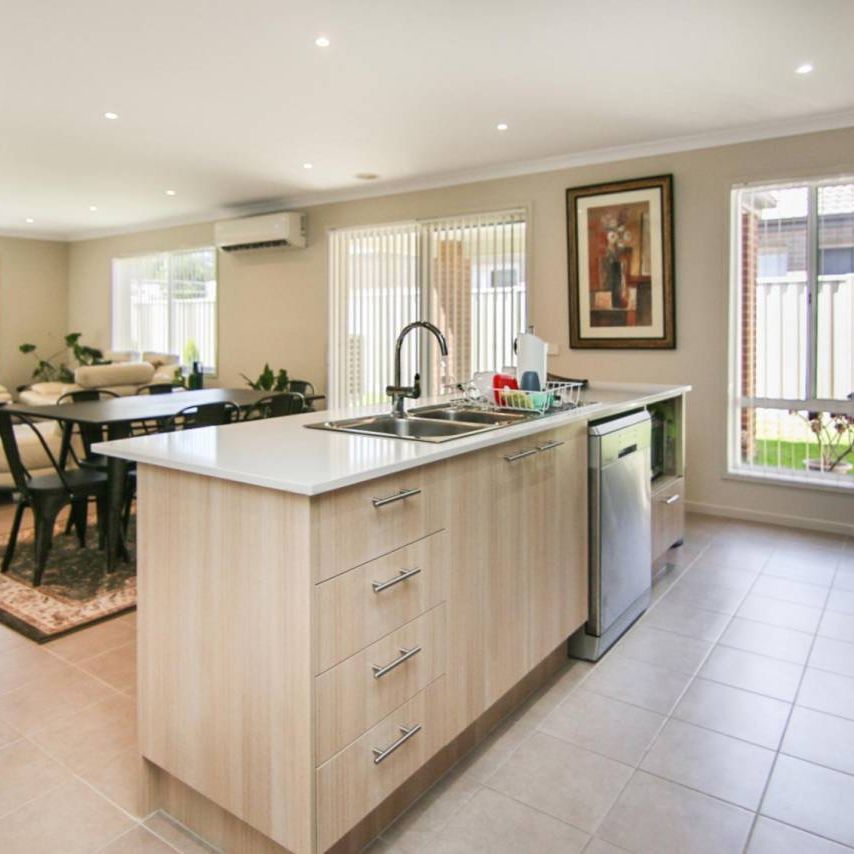 A PERFECT NEAT AND TIDY FAMILY HOME IN PRIME LOCATION - Photo 1