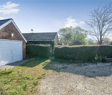 A two-bedroom cottage with driveway and garage in Oare village. - Photo 1