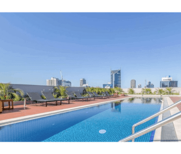 Stylish Two-Bedroom CBD Living with Resort-Style Amenities - Photo 4