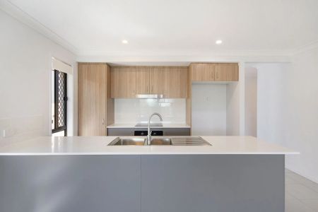 A modern sanctuary in a peaceful, family-friendly pocket, this beautifully finished 4-bedroom home delivers effortless living with a touch of luxury. - Photo 5