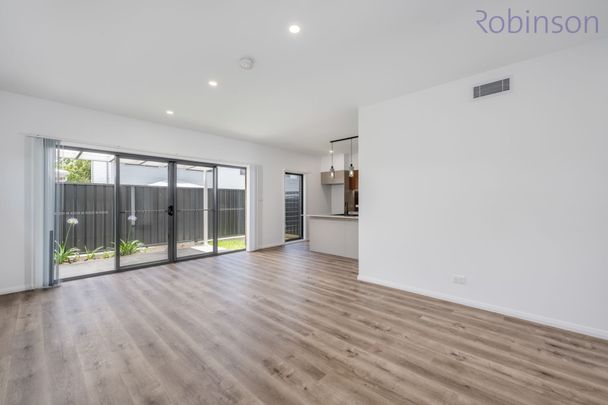 Brand new three bedroom townhouse where your pet may be welcome - Photo 1