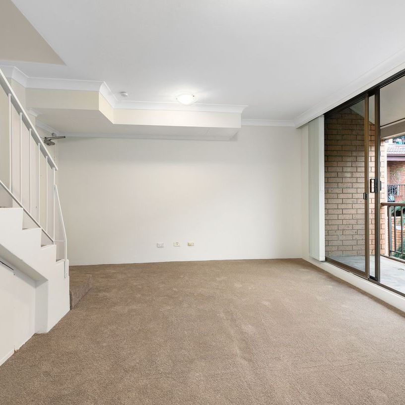 Chic Split Level Retreat with Leafy Outlooks - Photo 1