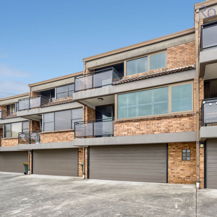 Larger than average, air-conditioned townhouse with district views and a double garage. - Photo 1