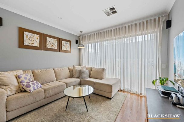 Welcoming Family Home with Open Living Spaces and Home Office - Photo 1