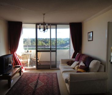 Spacious air-conditioned top floor unit - Photo 2