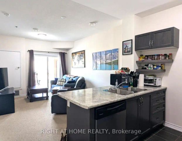 210 - 1360 COSTIGAN ROAD — 1 Bedroom - Photo 1