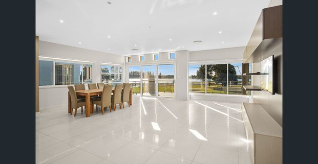 COMFORTABLE LAKESIDE LIVING WITH PRACTICAL INTERNAL FEATURES - Photo 1