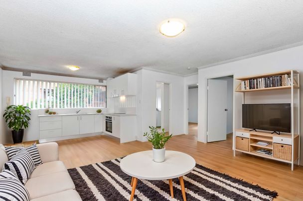 FRESHLY RENOVATED HOME IN A SECURE COMPLEX - Photo 1