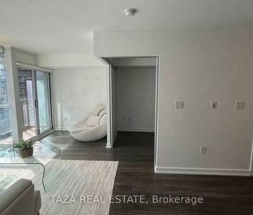 Feels brand new entertainment district + den parking included! - Photo 1