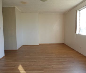 NEAT 1ST FLOOR UNIT WITH TRAIN STATION ACROSS THE ROAD - Photo 1