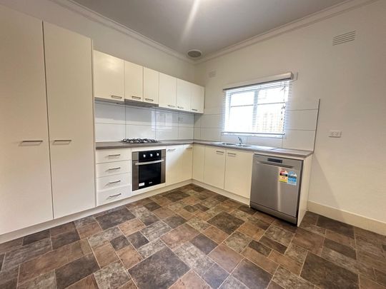 Spacious 3-Bedroom Home with Sunroom & Great Backyard - Photo 1