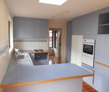 Comfortable Family Home with Modern Updates in a Convenient Location - Photo 1